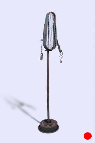Metal sculpture - metal pole topped with lantern surrounded by metal hoop