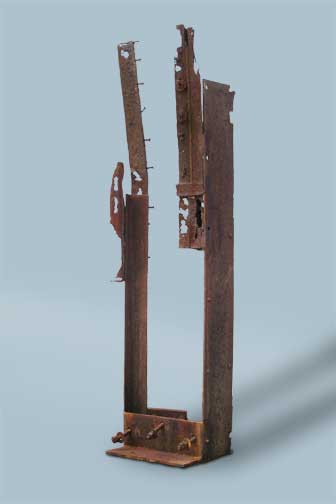 Metal Sculpture - Two rusted metal spires look like a ruin