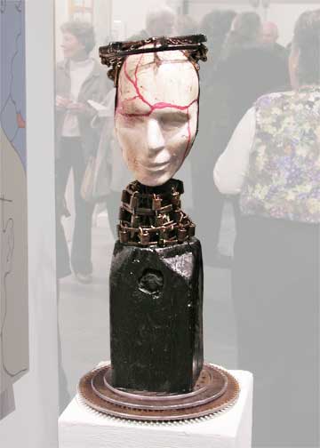 Pedestal toped with crowned, 2-sided head