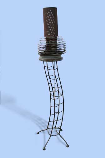 Metal sculpture - metal pole topped with lantern surrounded by metal hoop