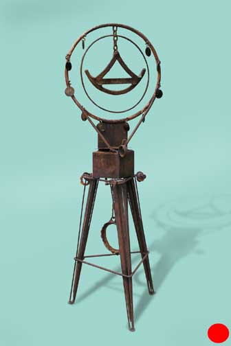 Metal sculpture - Metal hops surround a sythe-like metal piece